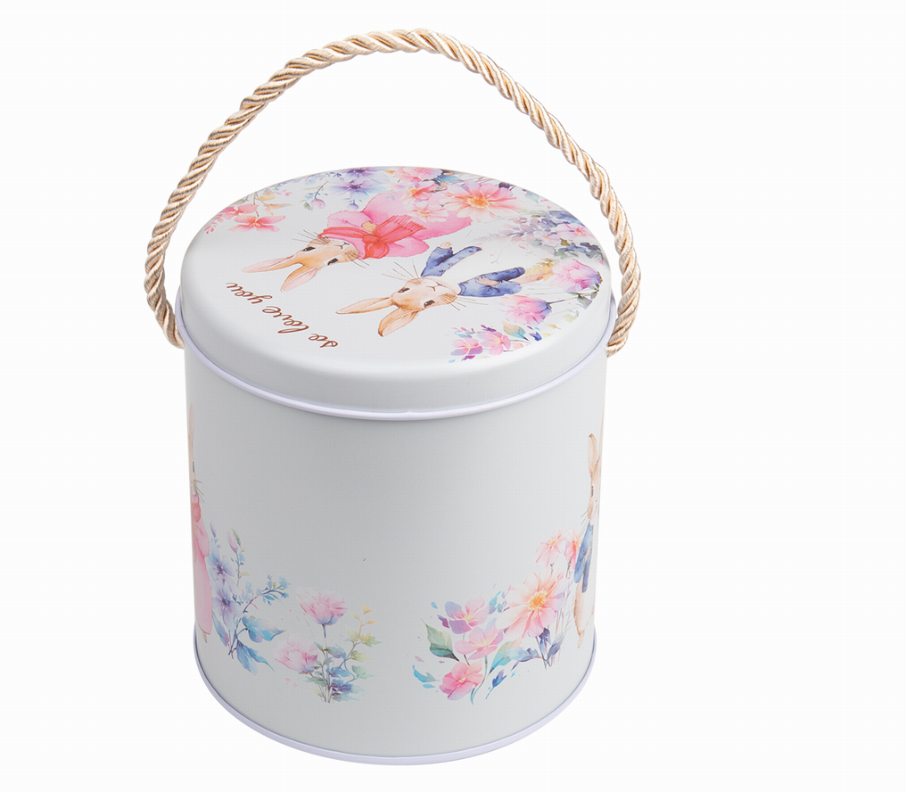 white round tea tin pail with floral lid and rope handle